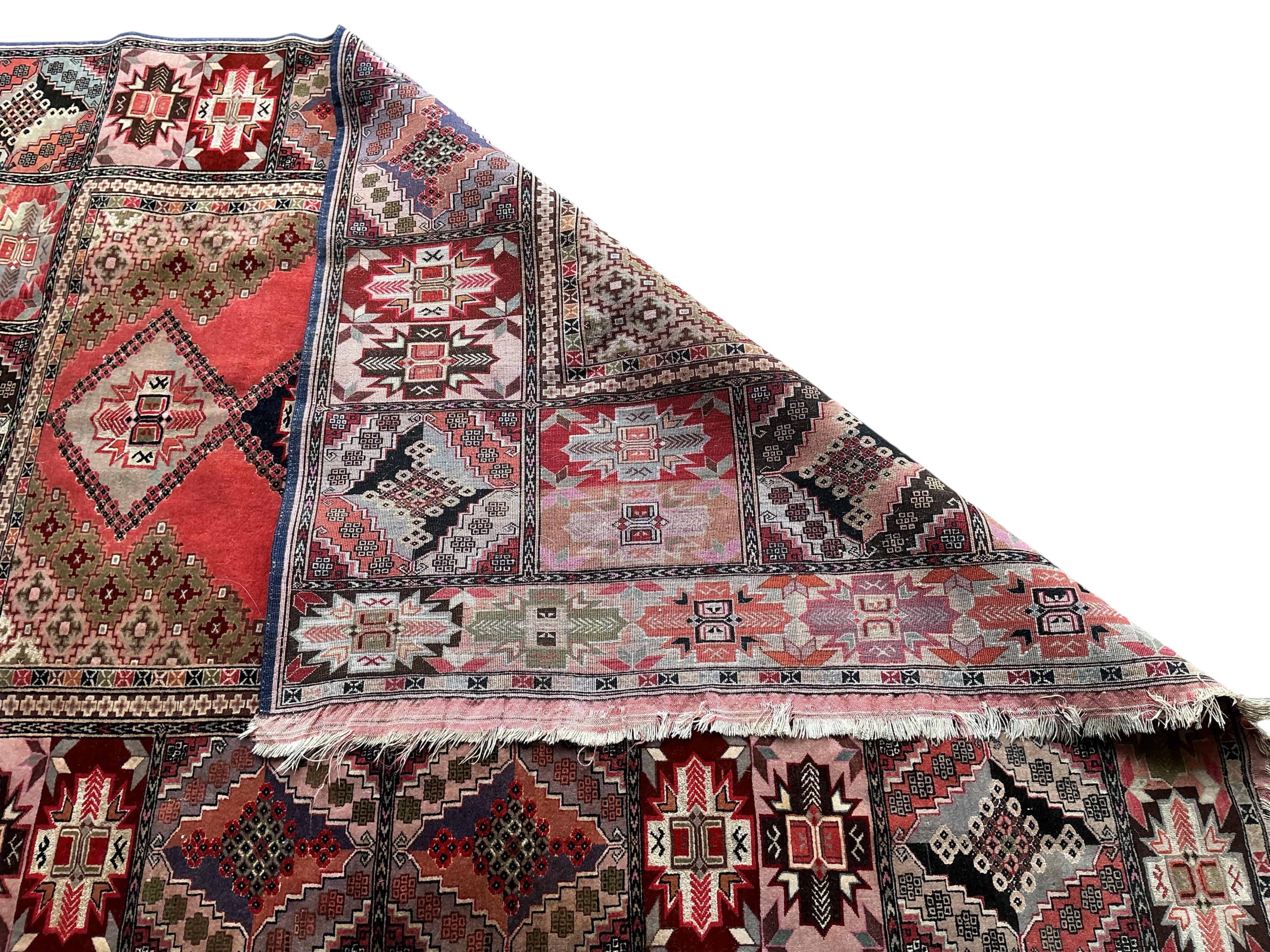 A North West Persian peach ground part silk rug and a Caucasian style rug, larger 175 x 126cm